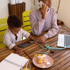 high-angle-mother-working-from-home_23-2149748374